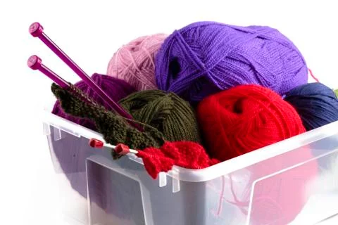 Plastic box with knitting needles and wool Stock Photos