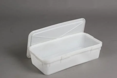 Plastic box with a lid, on a white background Stock Photos
