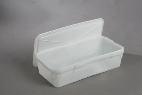 Plastic box with a lid, on a white background Stock Photos