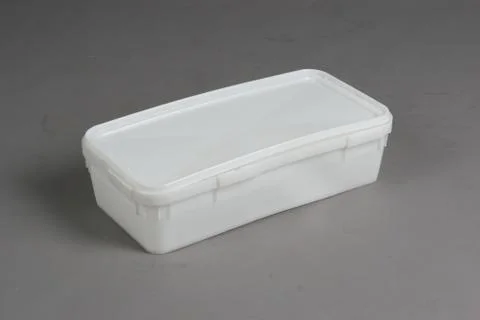 Plastic box with a lid, on a white background Stock Photos