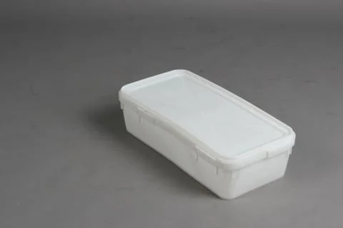 Plastic box with a lid, on a white background Stock Photos