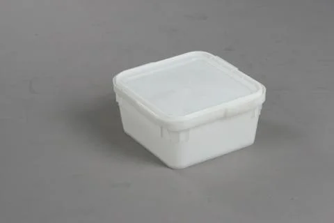 Plastic box with a lid, on a white background Stock Photos