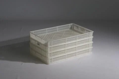 Plastic box with a lid, on a white background Stock Photos