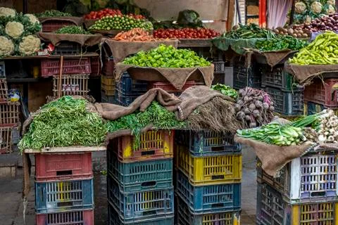 .plastic boxes with fresh vegetables on the counter of the Arab market Foto stock