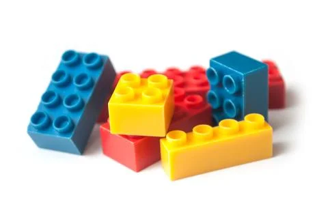 Plastic bricks construction on white background Stock Photos
