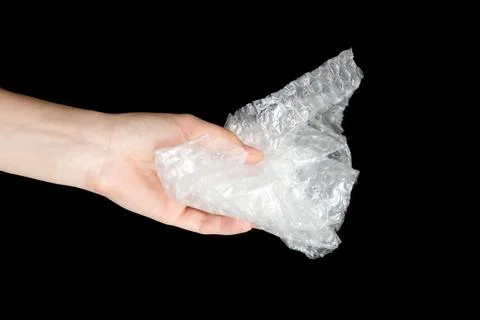 Plastic bubble wrap polyethylene package material in hand. Recycling, electri Stock Photos