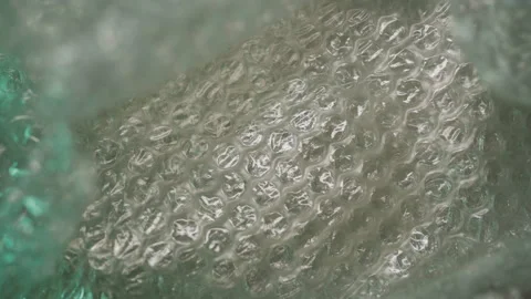 Plastic bubble wrap texture with moving light Stock Footage 312211563
