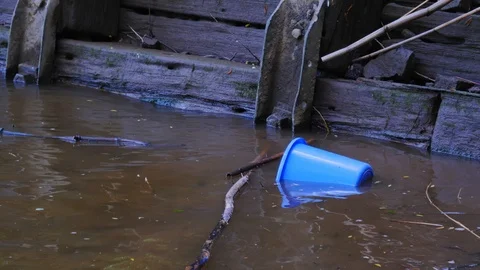 Plastic bucket floating in water after a flood, Water coming during a hurricane 스톡 동영상 108675987