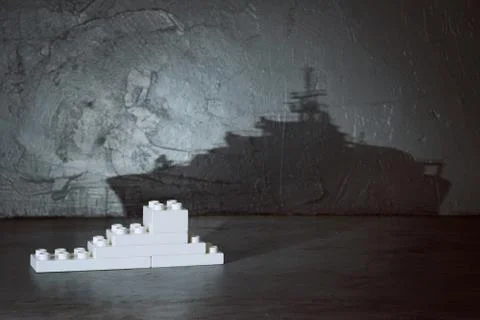Plastic building blocks with ship shadow . Creative and ideal concept . Concr Stock Photos