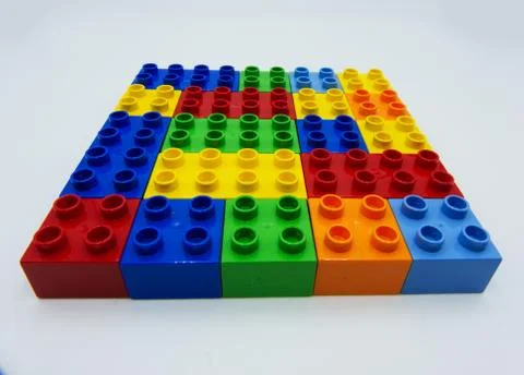 Plastic building blocks on white background Stock Photos