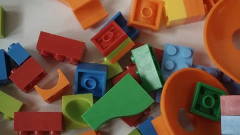 Plastic building blocks on a white background, close-up. Foto stock