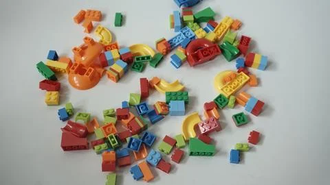 Plastic building blocks on a white background, close-up. Foto stock