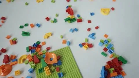Plastic building blocks on a white background, close-up. Foto stock