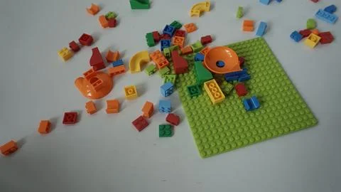 Plastic building blocks on a white background, close-up. Stock Photos