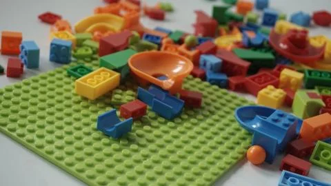 Plastic building blocks on a white background, close-up. Stock Photos
