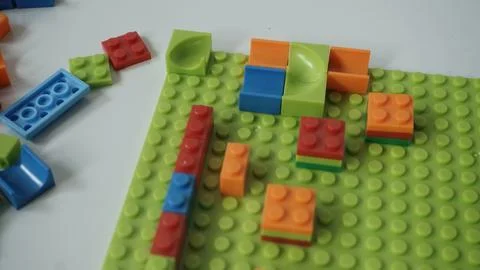 Plastic building blocks on a white background, close-up. Foto stock