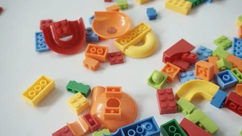 Plastic building blocks on a white background, close-up. Foto stock