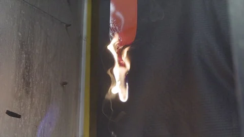 Plastic burn test in laboratory | Stock Video | Pond5