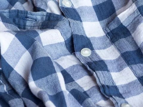 Plastic button on a shirt Stock Photos