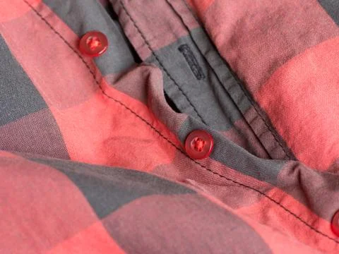 Plastic button on a shirt Stock Photos