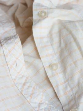 Plastic button on a shirt Foto stock