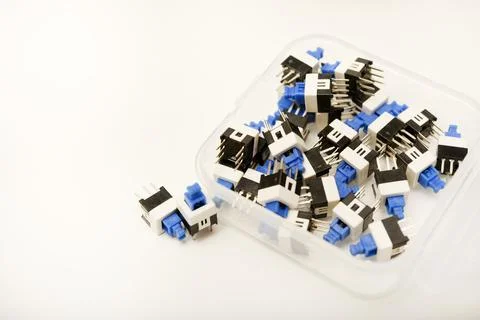 Plastic buttons in a box. Small buttons. Small buttons in electronics. Foto stock
