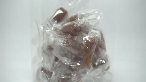 A plastic candy jar filled with ginger candy Stock Footage 296927336