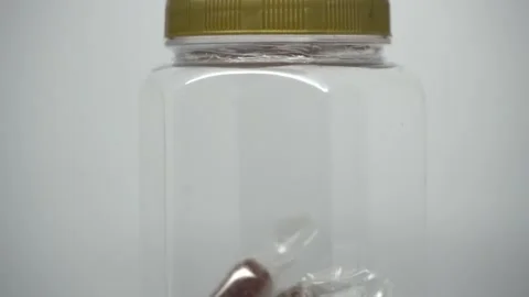 A plastic candy jar filled with ginger candy Stock Footage 296927348