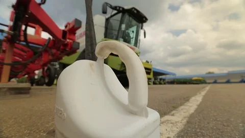 Plastic canister is on the pavement Stock Footage 73942307