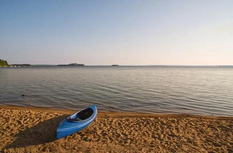 A plastic canoe in a beach Stock Photos
