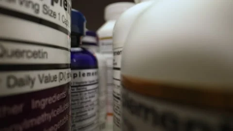 Plastic Cans for Tablets, Fish oil, Omega 3 or D-3 pills. The Camera Moves Stock Footage 231755668