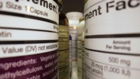 Plastic Cans for Tablets, Fish oil, Omega 3 or D-3 pills. The Camera Moves Stock Footage 238801190