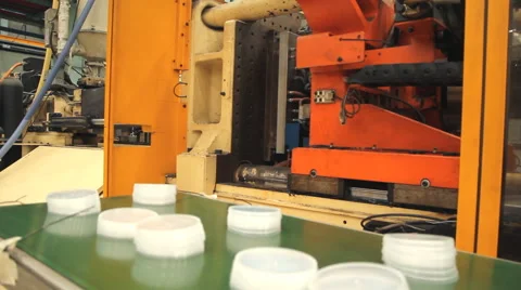 Plastic cap injection moulding machine Stock Footage 65012872