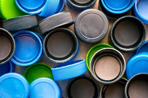 Plastic caps on black backgrounds. Stock Photos