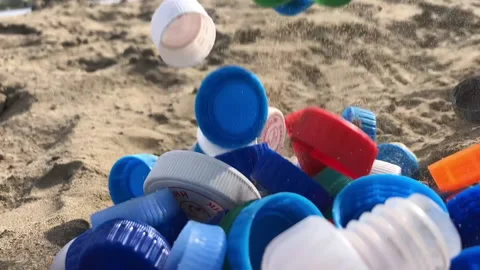 Plastic caps fly up Stock Footage 161698292