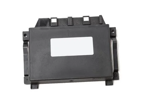 Plastic car engine control unit with metal elements on a white isolated backg 스톡 사진