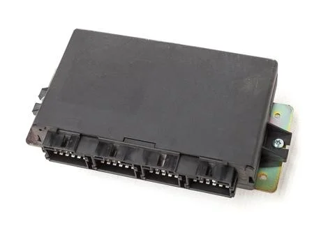 Plastic car engine control unit with plastic elements on a white isolated bac 스톡 사진