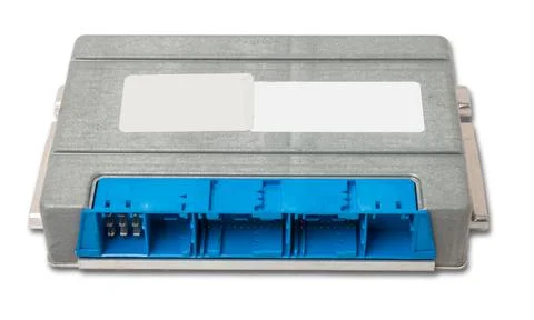 Plastic car engine control unit with metal elements on a white isolated backg Stock Photos