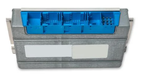 Plastic car engine control unit with metal elements on a white isolated backg Stock Photos