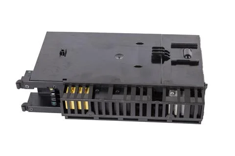 Plastic car engine control unit with metal elements on a white isolated backg Stock Photos