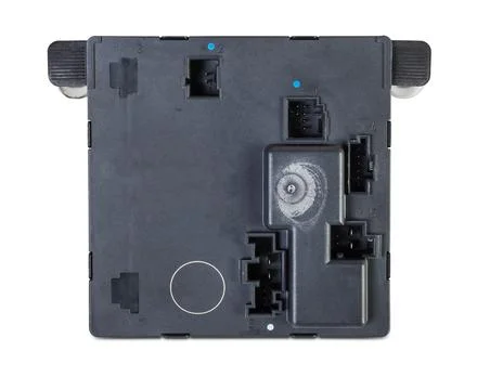Plastic car engine control unit with metal elements on a white isolated backg Stock Photos