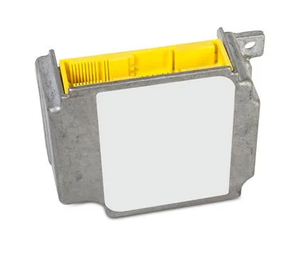 A plastic car engine control unit with metal elements on a white isolated bac Stock Photos