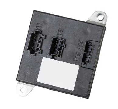 A plastic car engine control unit with metal elements on a white isolated bac Stock Photos