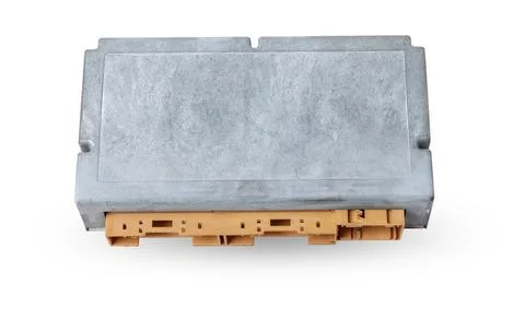 Plastic car engine control unit with metal elements on a white isolated backg Stock Photos