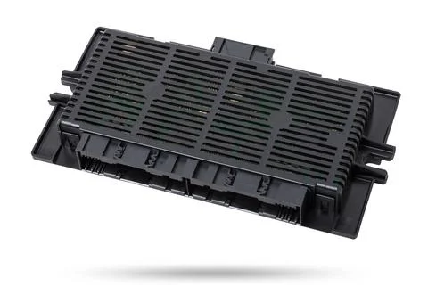 Plastic car engine control unit with plastic elements on a white isolated b.. 库存照片