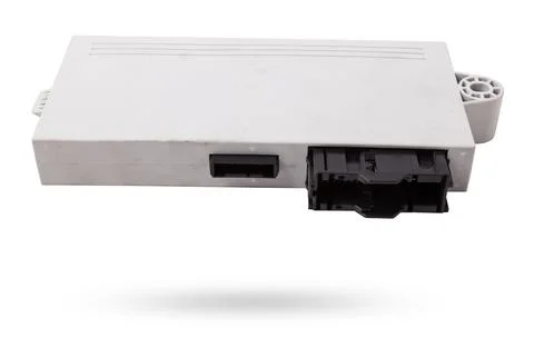 Plastic car engine control unit with metal elements on a white isolated bac.. Stock Photos
