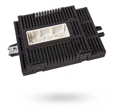 Plastic car engine control unit with metal elements on a white isolated bac.. Stock Photos