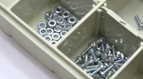 Plastic Case with Hardware Items Closeup. Dolly Motorized Shot.. 4K UltraHD, UHD Stock Footage 49175100