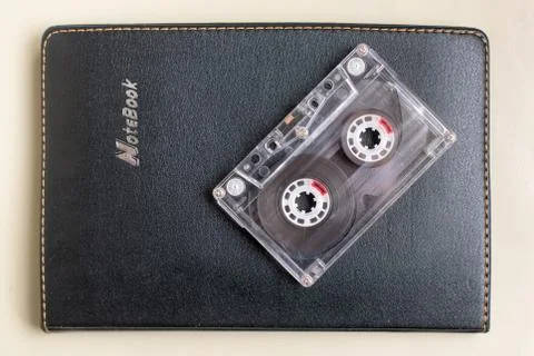 Plastic cassette on a black notebook Foto stock