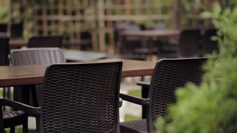 Plastic chairs and plastic tables in the forest café in the open air. Stock Footage 100892536